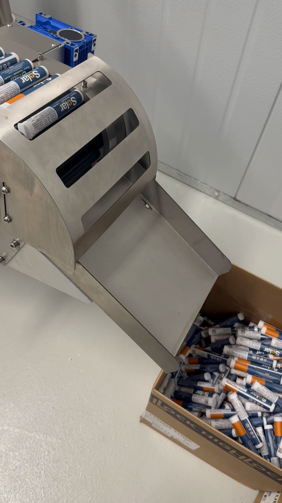 Labeled product coming off a machine on Solar's packaging line